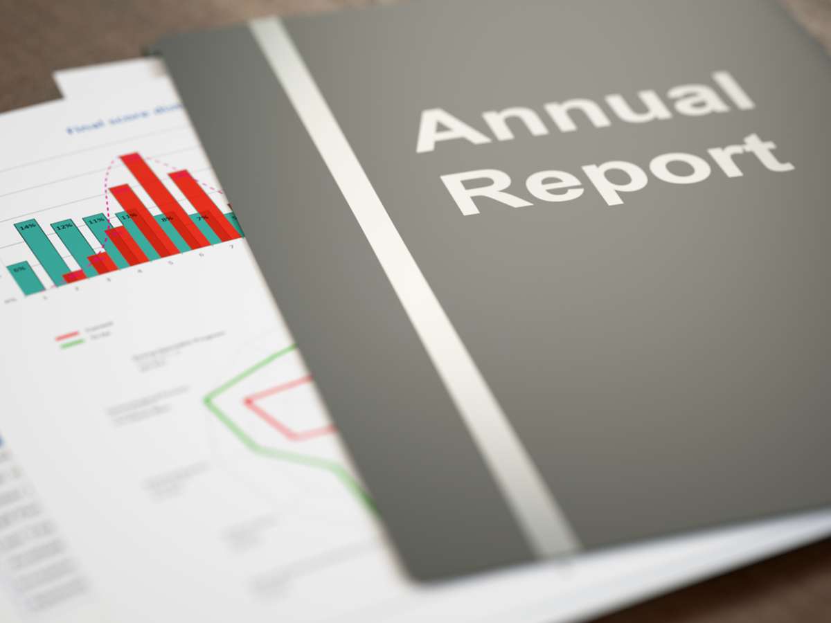 Black annual report folder with graphs and charts close-up