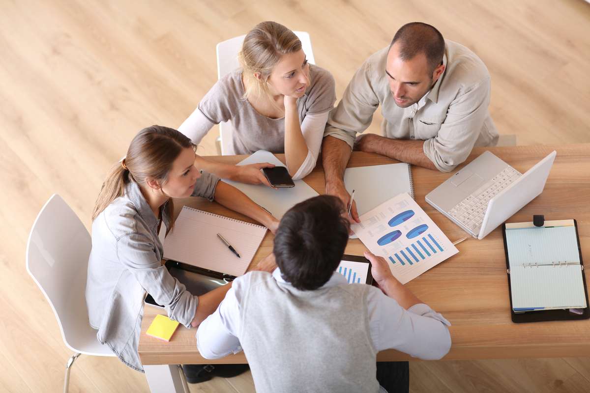 Business people around table (R) (S)