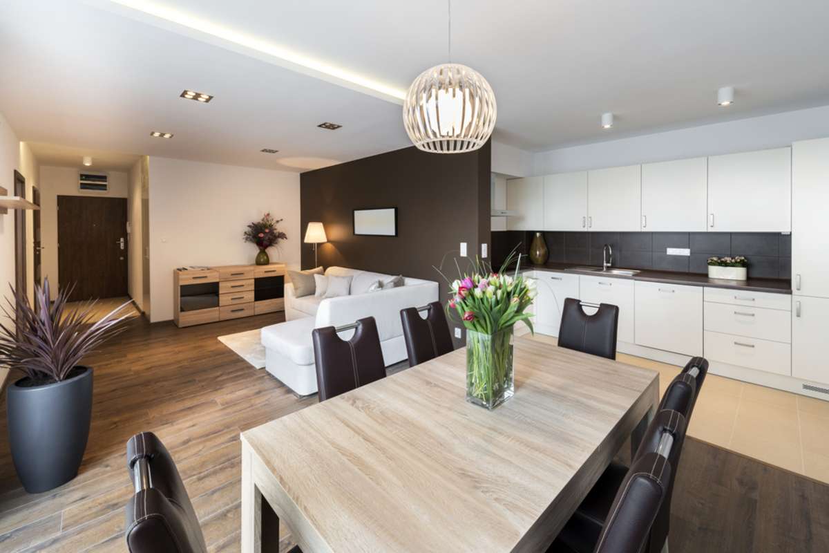 Luxurious kitchen with living area in background